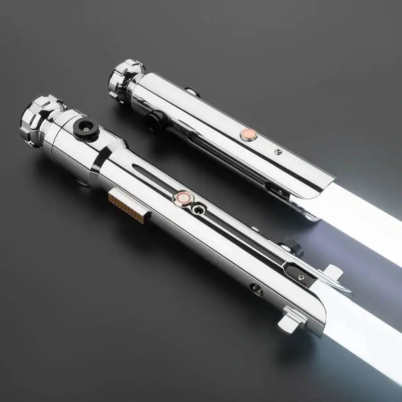 Two silver lightsaber on a black surface.